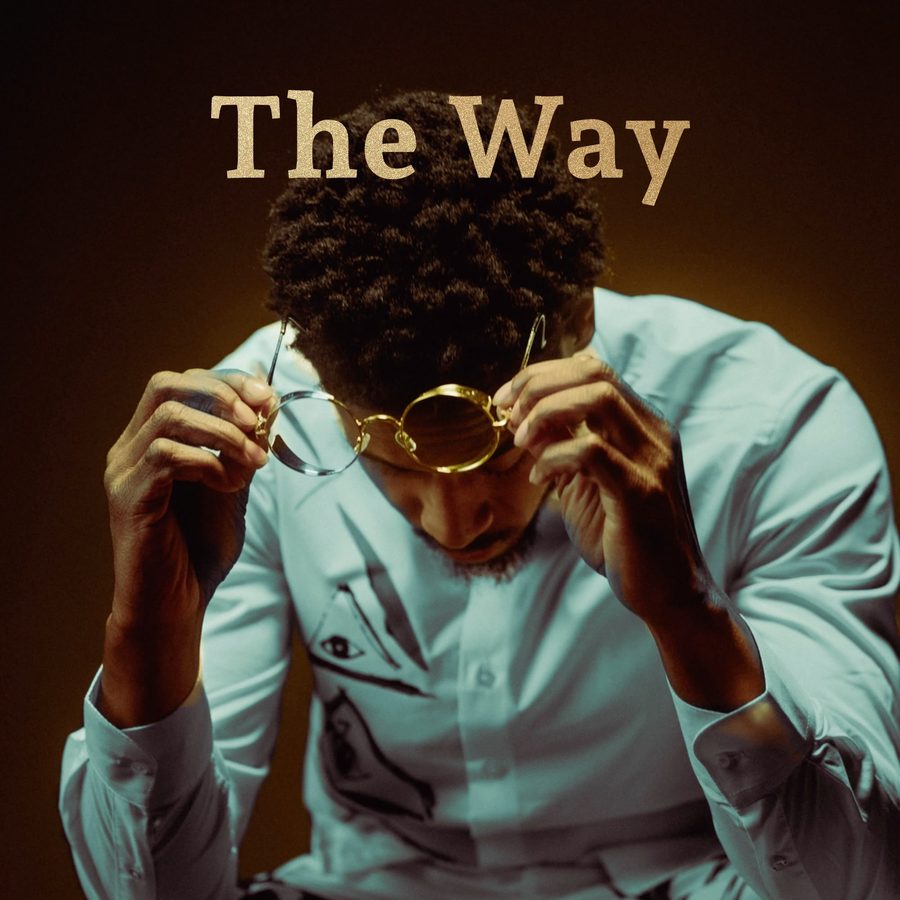 Cover art for The Way: Silent 777 looking down and lifting gold round glasses, in a warm brown glow.