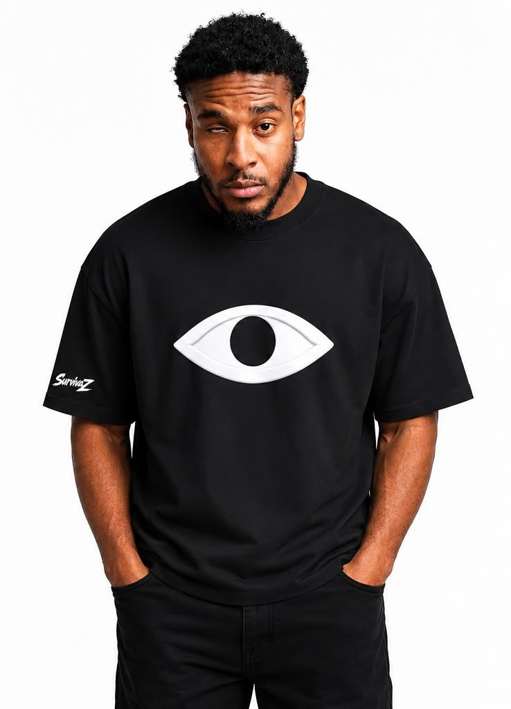 Black oversized tee with a raised white eye graphic and SurvivaZ on the sleeve.